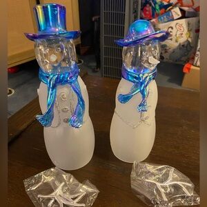 Frosted glass snowman and snow woman.